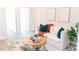Modern living room boasts neutral colors, wood flooring, comfortable seating, and recessed lighting at 109 S Plum St, Durham, NC 27703