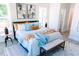 Light-filled main bedroom with neutral color palette, decorative art, and stylish furnishings at 109 S Plum St, Durham, NC 27703