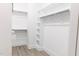 Organized walk-in closet with ample shelving and hanging space for storage at 109 S Plum St, Durham, NC 27703