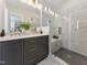 Modern bathroom featuring dual sinks, sleek vanity and glass enclosed walk-in shower at 11549 Helmond Way # 103, Raleigh, NC 27617