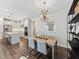 A view of the dining room, with light wood table and gray chairs at 11549 Helmond Way # 103, Raleigh, NC 27617