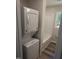 View of the bathroom and laundry area; features a stand-up shower and gray vanity at 1165 John Mitchell Rd, Youngsville, NC 27596