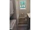 Bathroom features a stand-up shower, toilet, vanity, and a window to the outside at 1165 John Mitchell Rd, Youngsville, NC 27596