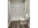 Bathroom features a clean, white stand-up shower and modern toilet at 1165 John Mitchell Rd, Youngsville, NC 27596