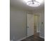 This bedroom has a modern ceiling fan, neutral paint, and a view to another room at 1165 John Mitchell Rd, Youngsville, NC 27596