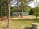 Front exterior showcasing a house with light blue siding, a dark door, and new wooden decks at 1165 John Mitchell Rd, Youngsville, NC 27596