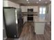 A spacious kitchen with stainless steel appliances, an island, and plenty of cabinet space at 1165 John Mitchell Rd, Youngsville, NC 27596