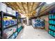 Organized basement with shelving, storage containers, and insulation visible on the ceiling, providing ample storage space at 12 Innisfree Dr, Durham, NC 27707