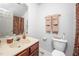 Bathroom featuring single sink vanity, large mirror, and shower-tub combination at 12 Innisfree Dr, Durham, NC 27707