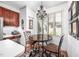 Cozy breakfast nook with chandelier, window view, and adjacent kitchen features at 12 Innisfree Dr, Durham, NC 27707