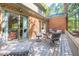 Relax on this inviting deck featuring a glass table and comfortable seating, perfect for outdoor gatherings at 12 Innisfree Dr, Durham, NC 27707