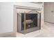 Classic fireplace with decorative screen, wooden mantle, and neutral surround, offering warmth and charm at 12 Innisfree Dr, Durham, NC 27707