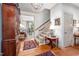 Inviting foyer with hardwood floors, chandelier, staircase, and traditional decor at 12 Innisfree Dr, Durham, NC 27707