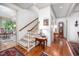 Elegant foyer with staircase, hardwood floors, chandelier, and tasteful decor at 12 Innisfree Dr, Durham, NC 27707