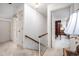 Bright hallway with staircase leading to a bedroom and bathroom, all well-lit with white walls at 12 Innisfree Dr, Durham, NC 27707