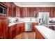 Updated kitchen with stainless steel appliances, ample cabinet space, and hardwood flooring at 12 Innisfree Dr, Durham, NC 27707