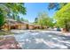 Charming neighborhood street featuring brick townhomes with carports and well-maintained landscaping at 12 Innisfree Dr, Durham, NC 27707