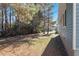 A home featuring a big backyard and mature trees at 1203 Freeman Dr, Sanford, NC 27330