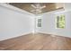 Bedroom features a wood ceiling with fan and natural light from two windows at 1222 Red Cedar Ct, Youngsville, NC 27596