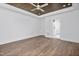 Spacious bedroom with a wood ceiling, ceiling fan, and access to the bathroom at 1222 Red Cedar Ct, Youngsville, NC 27596