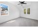 Bright bedroom with two windows offering ample natural light and neutral walls and carpet at 1222 Red Cedar Ct, Youngsville, NC 27596