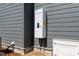 Modern tankless hot water heater fixed to the siding on exterior of the home at 1222 Red Cedar Ct, Youngsville, NC 27596