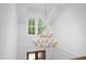 Grand foyer with a two-tiered chandelier, hardwood floors, and a view of the staircase at 1222 Red Cedar Ct, Youngsville, NC 27596