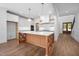 Spacious kitchen with a large island, white cabinets, wooden accents, and modern appliances at 1222 Red Cedar Ct, Youngsville, NC 27596