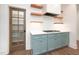 Kitchen with a modern gas cooktop, white countertops, and custom cabinetry at 1222 Red Cedar Ct, Youngsville, NC 27596