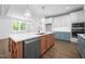 Bright kitchen featuring a large island, a stainless steel dishwasher, and ample counter space at 1222 Red Cedar Ct, Youngsville, NC 27596