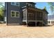 Back of the home with a screened porch, steps to the yard, and durable exterior siding at 1222 Red Cedar Ct, Youngsville, NC 27596