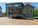 Rear exterior with a screened-in porch and steps leading to the backyard at 1222 Red Cedar Ct, Youngsville, NC 27596
