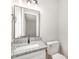Bathroom featuring a granite vanity with a modern faucet and a toilet at 124 Strickland Dr, Smithfield, NC 27577