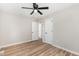 Bedroom with wood-look floors, ceiling fan and a closet with a door at 124 Strickland Dr, Smithfield, NC 27577