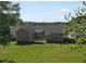 The backyard features a wooden deck, a well-maintained lawn, and a backdrop of lush greenery at 1301 Tawny View Ln, Raleigh, NC 27603