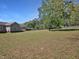 Expansive fenced backyard offering plenty of space for outdoor activities and gardening with lush green grass at 1301 Tawny View Ln, Raleigh, NC 27603