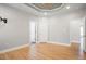 Bright bedroom showcasing hardwood floors, neutral walls, and multiple doorways at 1301 Tawny View Ln, Raleigh, NC 27603