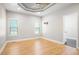 Spacious bedroom featuring hardwood floors, modern ceiling fan, and ample natural light at 1301 Tawny View Ln, Raleigh, NC 27603