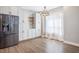 Bright dining area with stainless steel fridge, white cabinets, and natural light at 1301 Tawny View Ln, Raleigh, NC 27603
