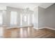 Open living room featuring hardwood flooring and abundant natural light throughout the space at 1301 Tawny View Ln, Raleigh, NC 27603