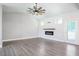 Bright living room with vaulted ceilings, a modern fireplace, and a door to the backyard at 1301 Tawny View Ln, Raleigh, NC 27603