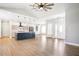A contemporary living room with an open floor plan, stylish lighting, and a view into the modern kitchen at 1301 Tawny View Ln, Raleigh, NC 27603
