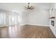 Open living room featuring hardwood flooring and a decorative fireplace with lots of natural light at 1301 Tawny View Ln, Raleigh, NC 27603