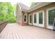 A brick home has a back deck perfect for entertaining guests at 14 Whit Ct, Angier, NC 27501