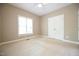 A simple carpeted bedroom with a ceiling fan and a large closet at 14 Whit Ct, Angier, NC 27501
