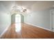 Spacious bedroom featuring hardwood floors and a bright windowed entryway at 14 Whit Ct, Angier, NC 27501