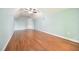 A bright bedroom with hardwood floors, blue walls, and lots of natural light at 14 Whit Ct, Angier, NC 27501