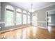 Bright dining room with hardwood floors and lots of windows for natural light at 14 Whit Ct, Angier, NC 27501