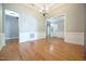 Large dining area with hardwood floors, natural light and a view into the living area at 14 Whit Ct, Angier, NC 27501