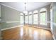 The spacious dining area is filled with lots of natural light from the many large arched windows at 14 Whit Ct, Angier, NC 27501